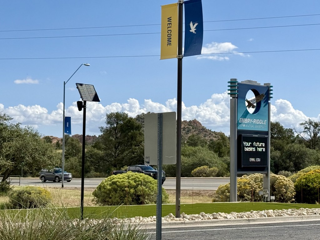Flock camera next to the Embry-Riddle welcome sign on Dan Carrell Drive.